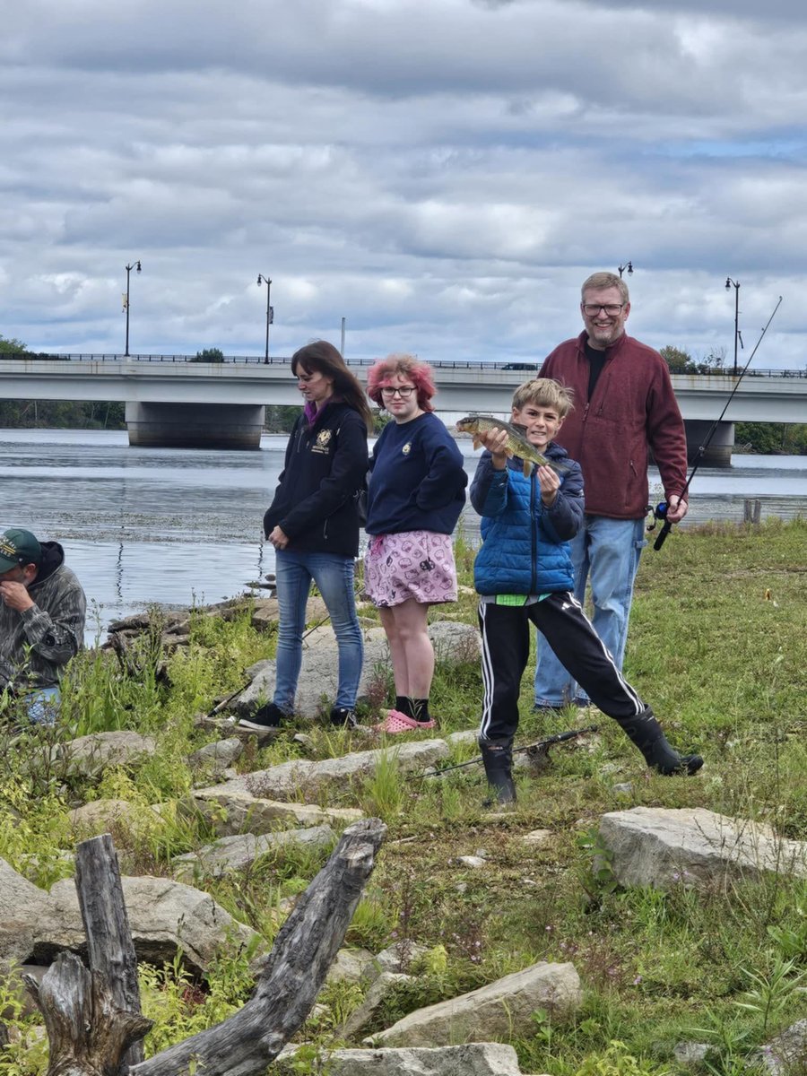 Members of Grace Community Church enjoying a fishing fellowship by the river
